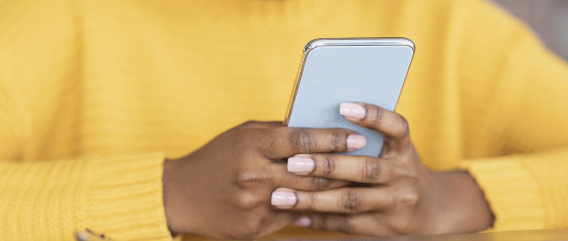 close up of woman holding smartphone
