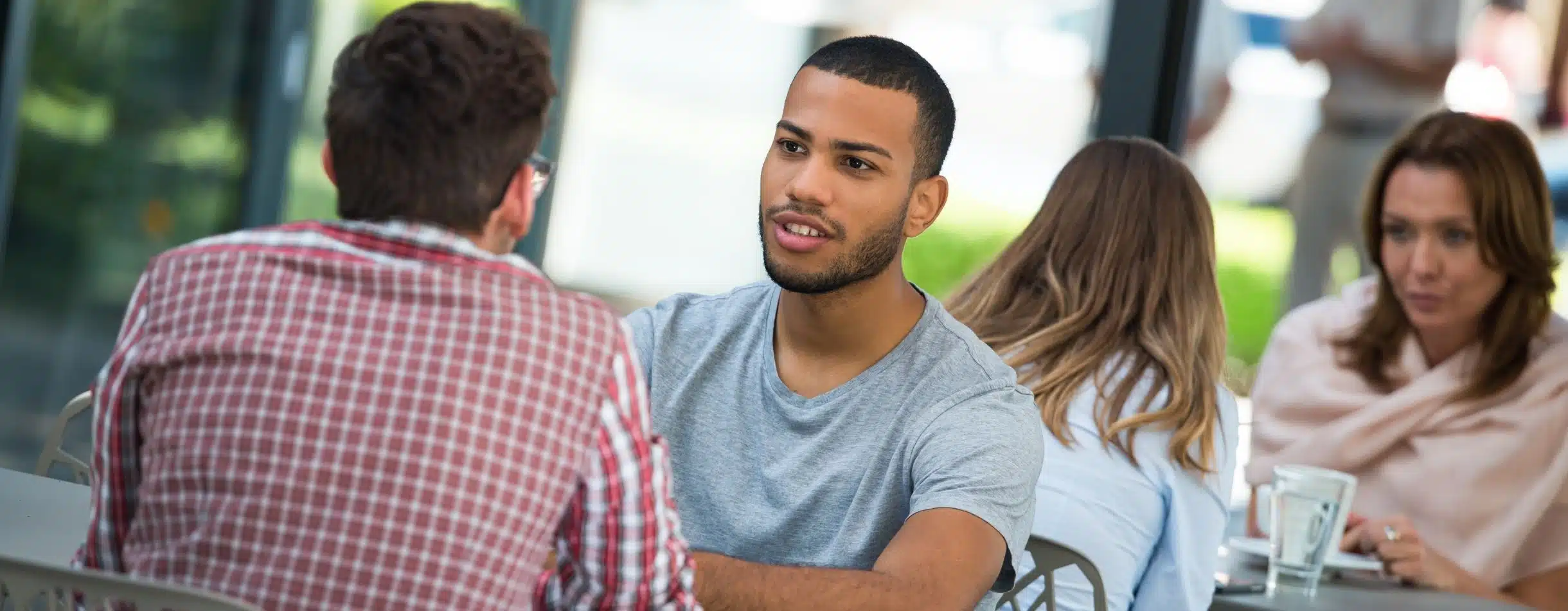 A potential donor having coffee with a fundraiser, showing the impact of proper donor engagement strategies.