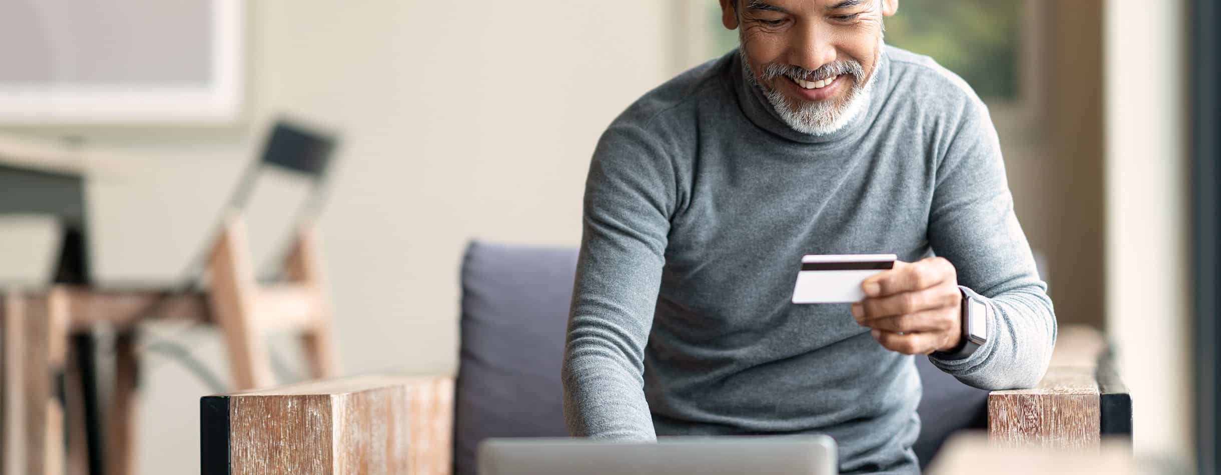 Man making online donation using credit card