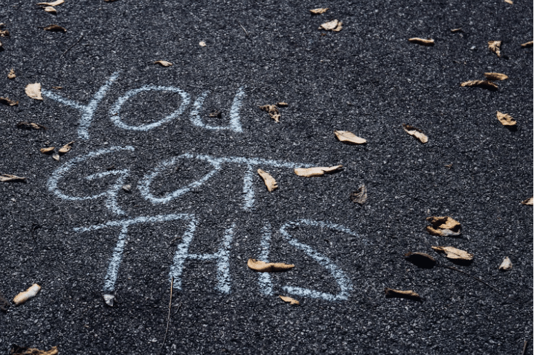 “You got this” written in chalk on the floor