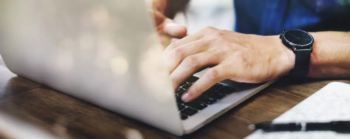 This image shows someone's hands using a computer.