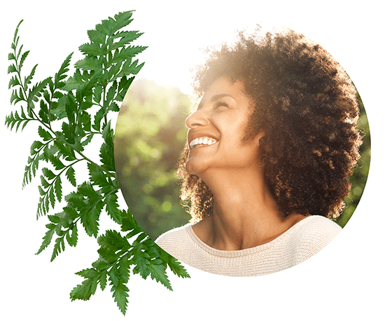 Happy person from National Park Foundation with a fern background