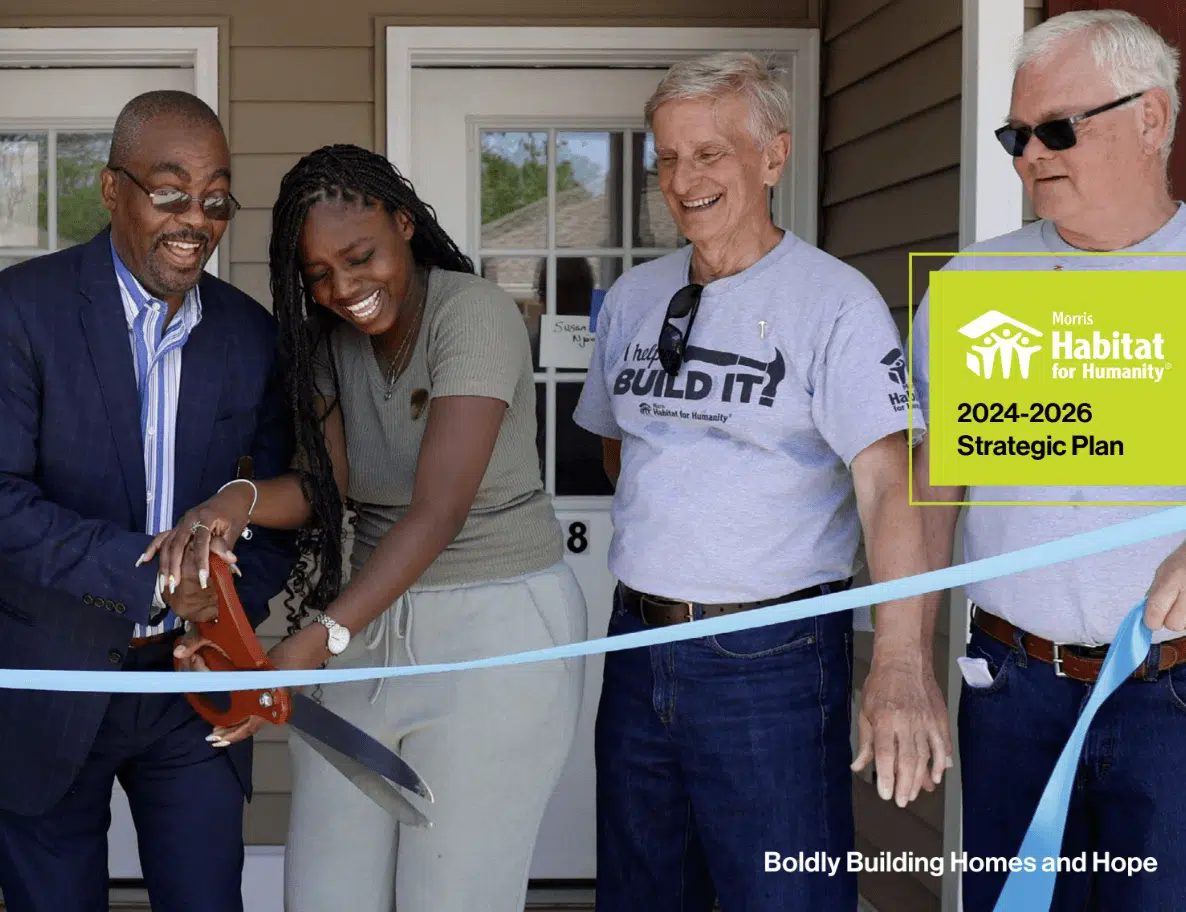 The cover image for the Morris Habitat for Humanity 2024-2026 Strategic Plan, showing a group of four people cutting a ribbon at a new house